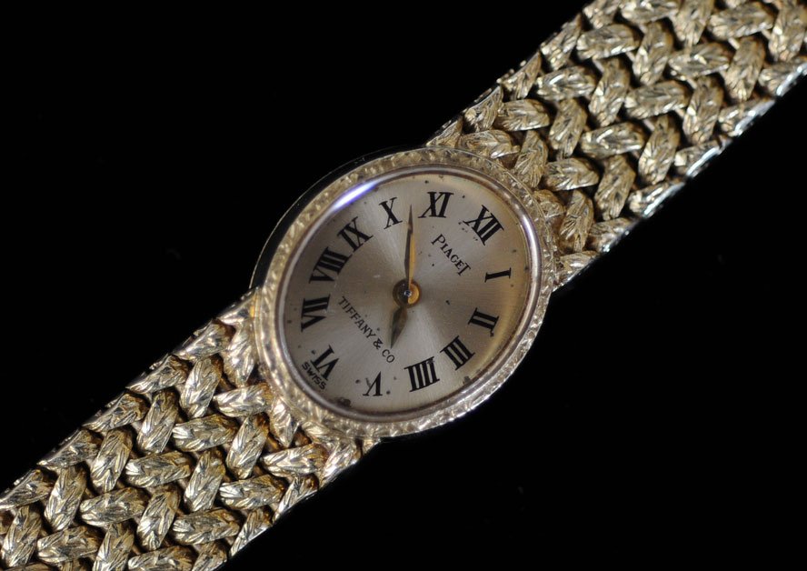 Piaget 18k Gold Ladies Wrist Watch: retailed by Tiffany & Company 6 1/4" long 28 dwt gross estimate 1000/1500 Shipping available within the Continental USA (excludes insurance) $25. International buyers are responsible for arranging 3rd