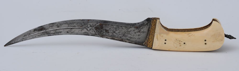 Fine Curved Dagger: probably Southeast Asia 9 1/4" blade late 19th century estimate 500/750 Shipping available within the Continental USA (excludes insurance) $30. International buyers are responsible for arranging 3rd p