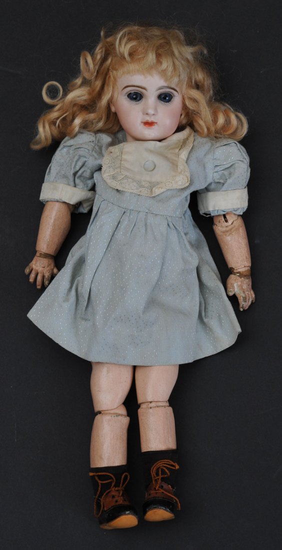 Tete Jumeau Bisque Doll: with old replaced costume signed on head and body 15" long, circa 1900, estimate 750/1000