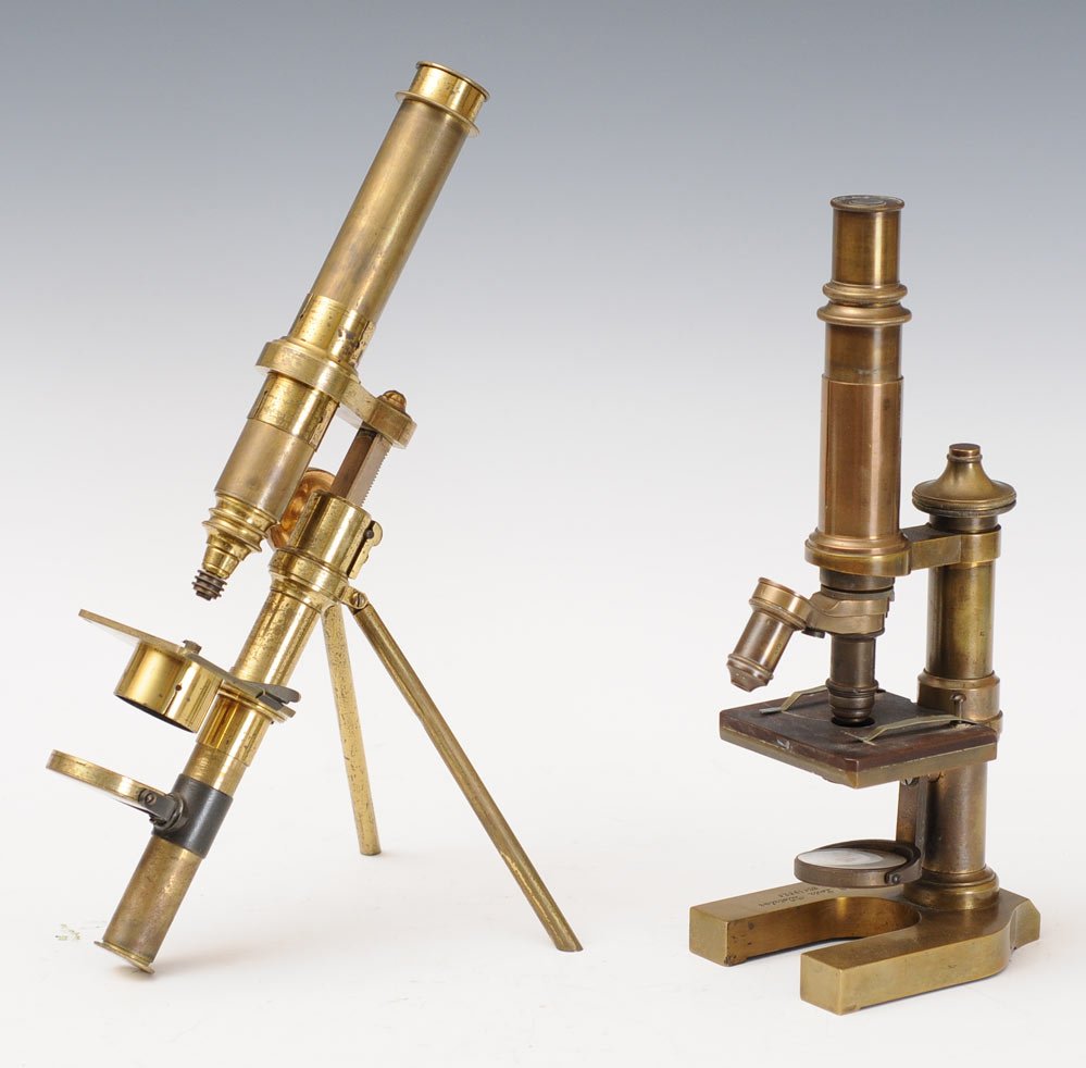 Pair of Brass Microscopes: one signed E. Lietz, the other unsigned on a tripod base larger 13" high, estimate 300/500