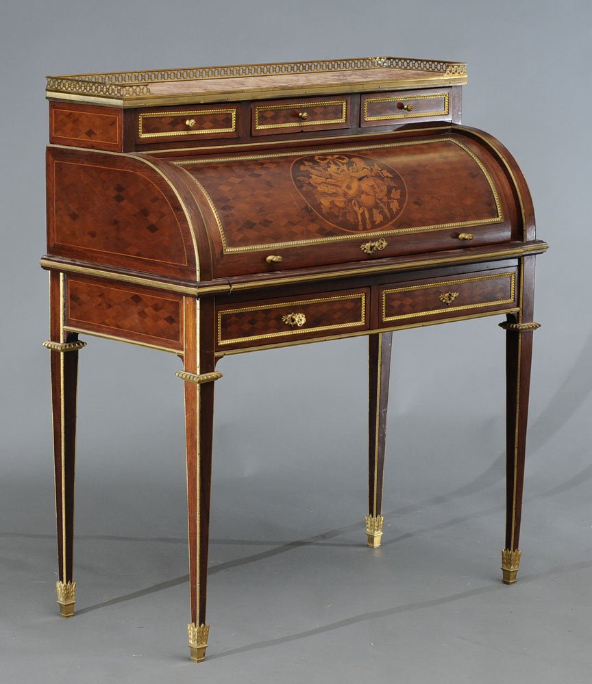 Louis XV Style Parquetry Desk: with brass mounts and marble top the cylinder roll with marquetry panel writing surface with embossed leather 37" x 19" x 43" high circa 1900