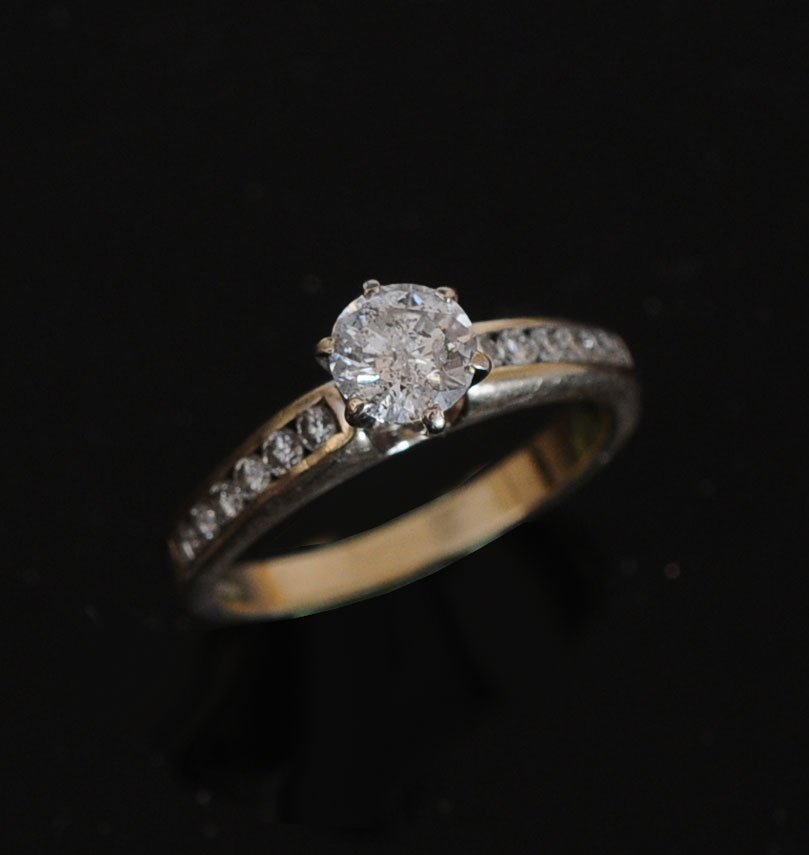 18K Diamond Solitaire Ring: approximately .75 ct center stone size 5 estimate 700/900