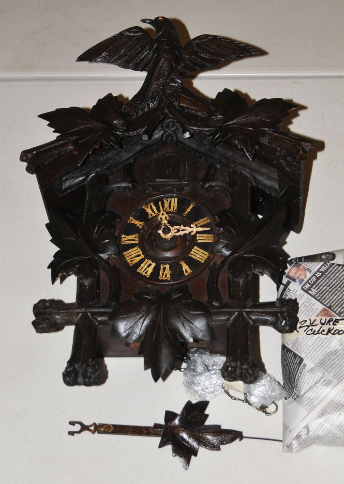 Black Forest Cuckoo Clock: with carved bird crest 17" long late 19th century estimate 200/400