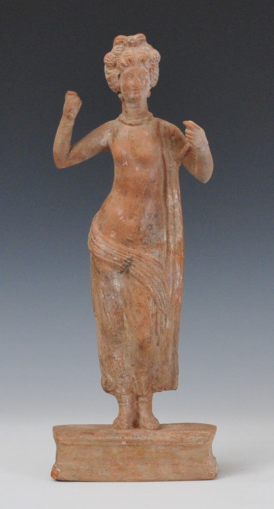 Syrian Terracotta Figure of Aphrodite: standing on a rectangular pedestal a mirror formerly in her left hand 20 1/2" high probably 2nd century, A.D.