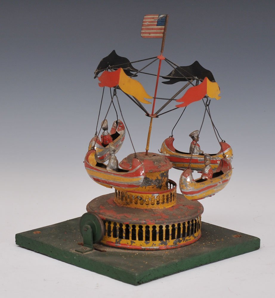Muller & Kadeder Round-About with Boats: hand painted tin late 19th century