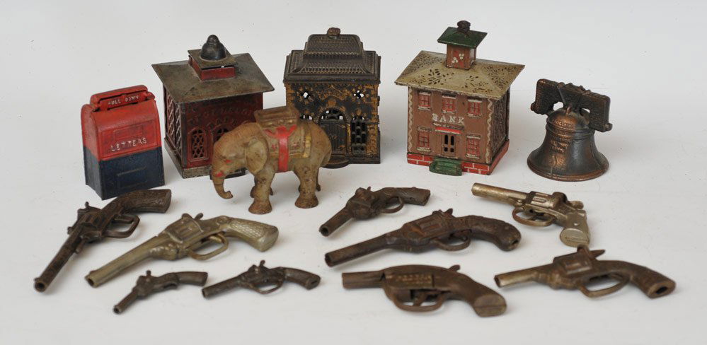 Group of 7 Still Banks and 9 Cap Guns: including four buildings, elephant, mail box and liberty bell banks and Ranger cap gun