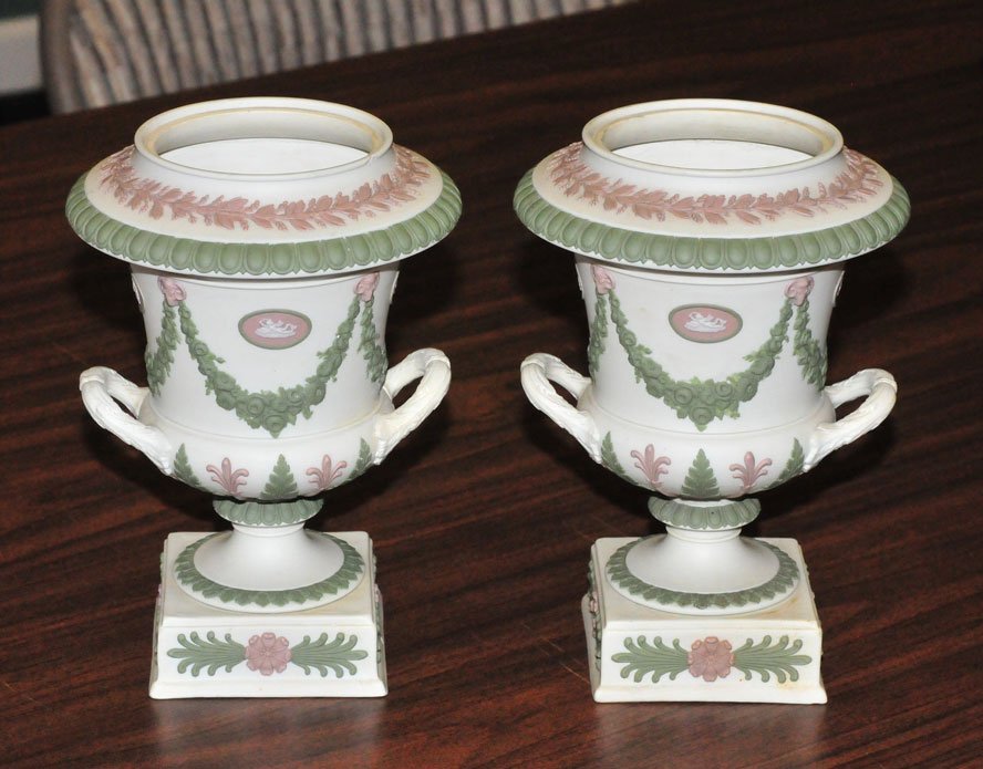 Pair of Wedgwood jasperware urns: 7 1/4" high, lacking lidsimpressed "Wedgwood"Condition" a few small flakes to the base of one.