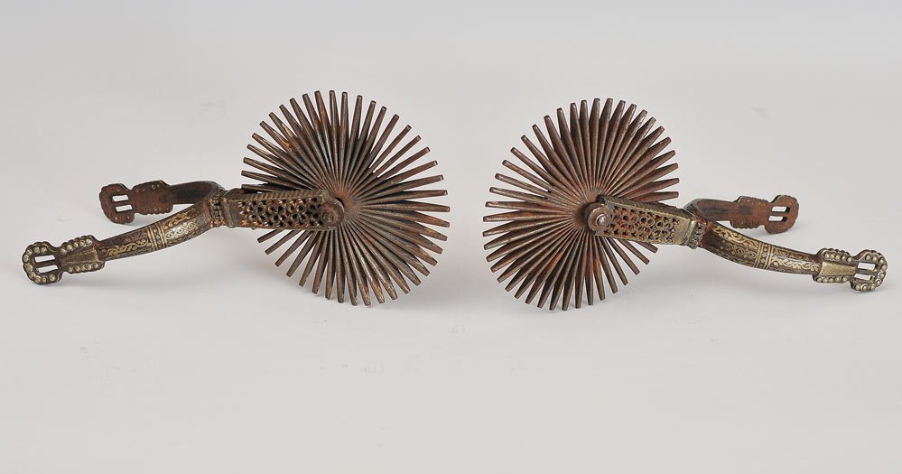 Pair of Gaucho Spurs: with metal inlay 9" long SHIPPING: Shipping available within the Continental USA (excludes insurance) $30. International buyers are responsible for arranging 3rd party shipping.