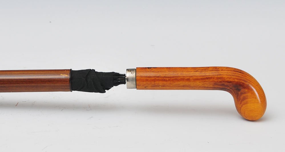 Mark Cross Umbrella Cane: an umbrella concealed in a grain painted telescopic walking stick 35" long 20th century SHIPPING: Shipping available within the Continental USA (excludes insurance) $40. International buyers are respo