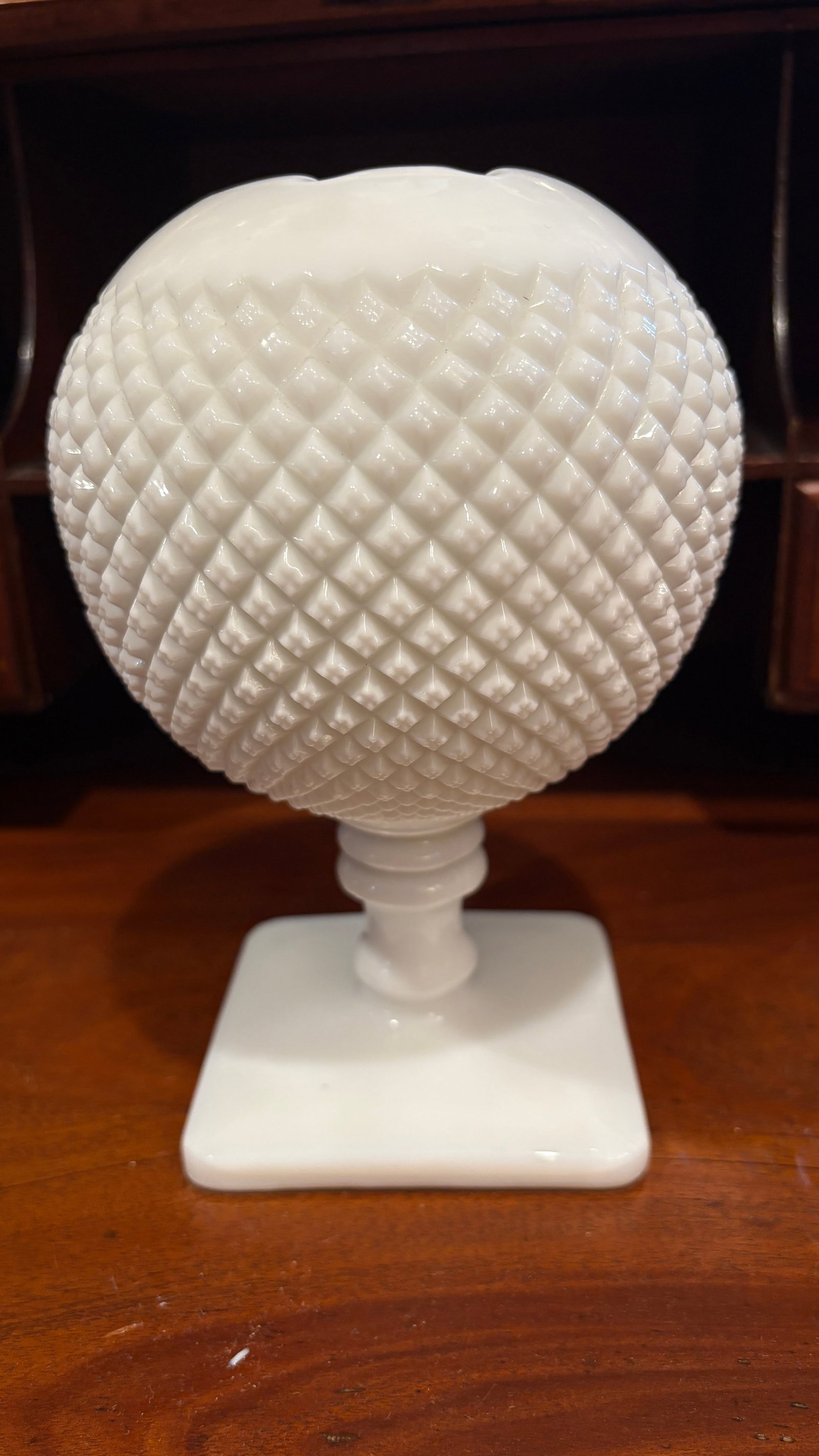 Westmoreland Milkglass Hobnail Rose Bowl: Westmoreland Glass Company, founded in 1888 in Grapeville, Pennsylvania, was renowned for its high-quality milk glass products. The company's signature hobnail pattern, characterized by raised bumps r