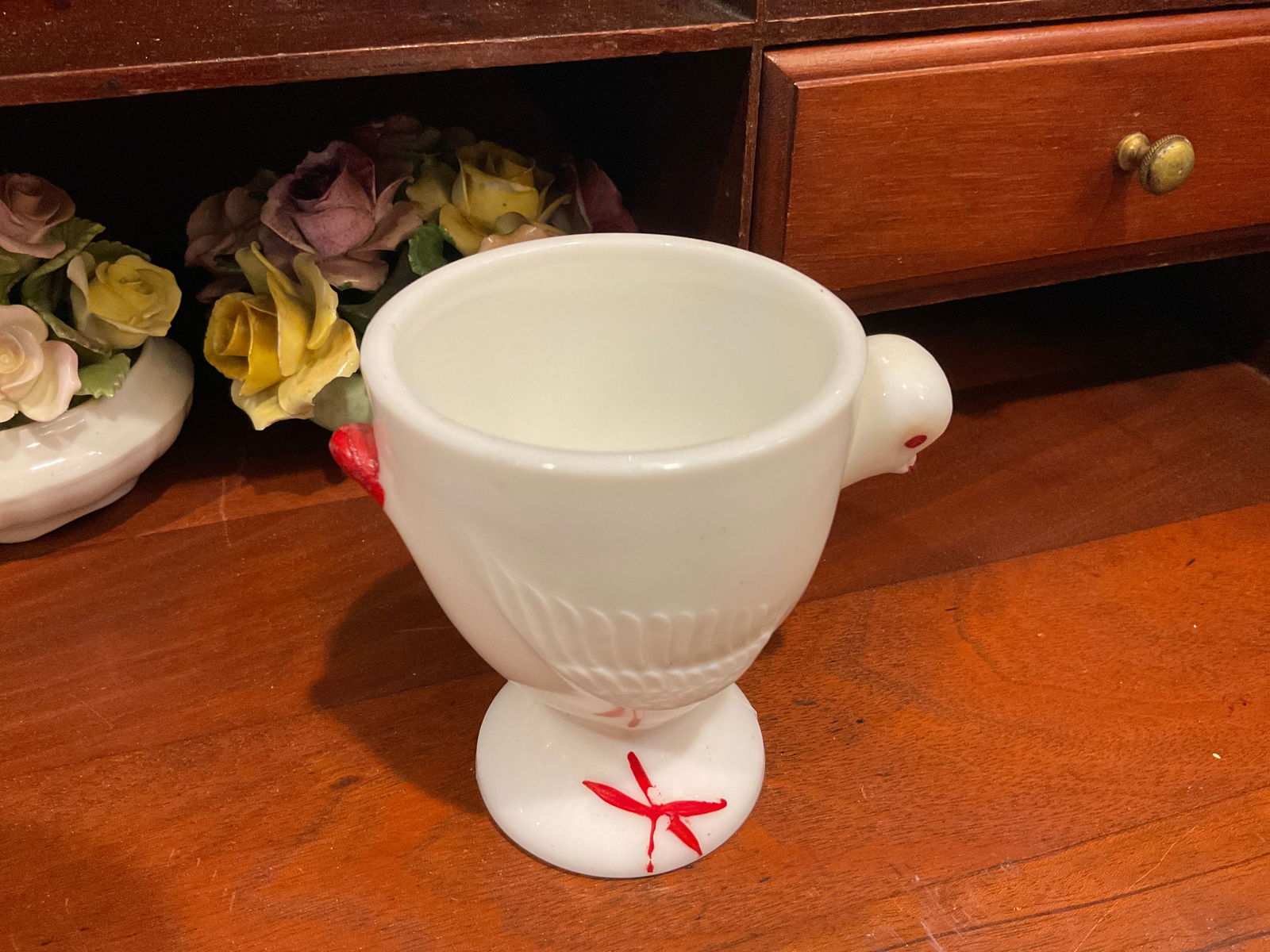 Milk Glass Rooster Egg Cup: Westmoreland Glass Company, founded in 1888, was known for its milk glass products, particularly during the mid-20th century. Their hen-on-nest dishes and other figural pieces were popular collectible