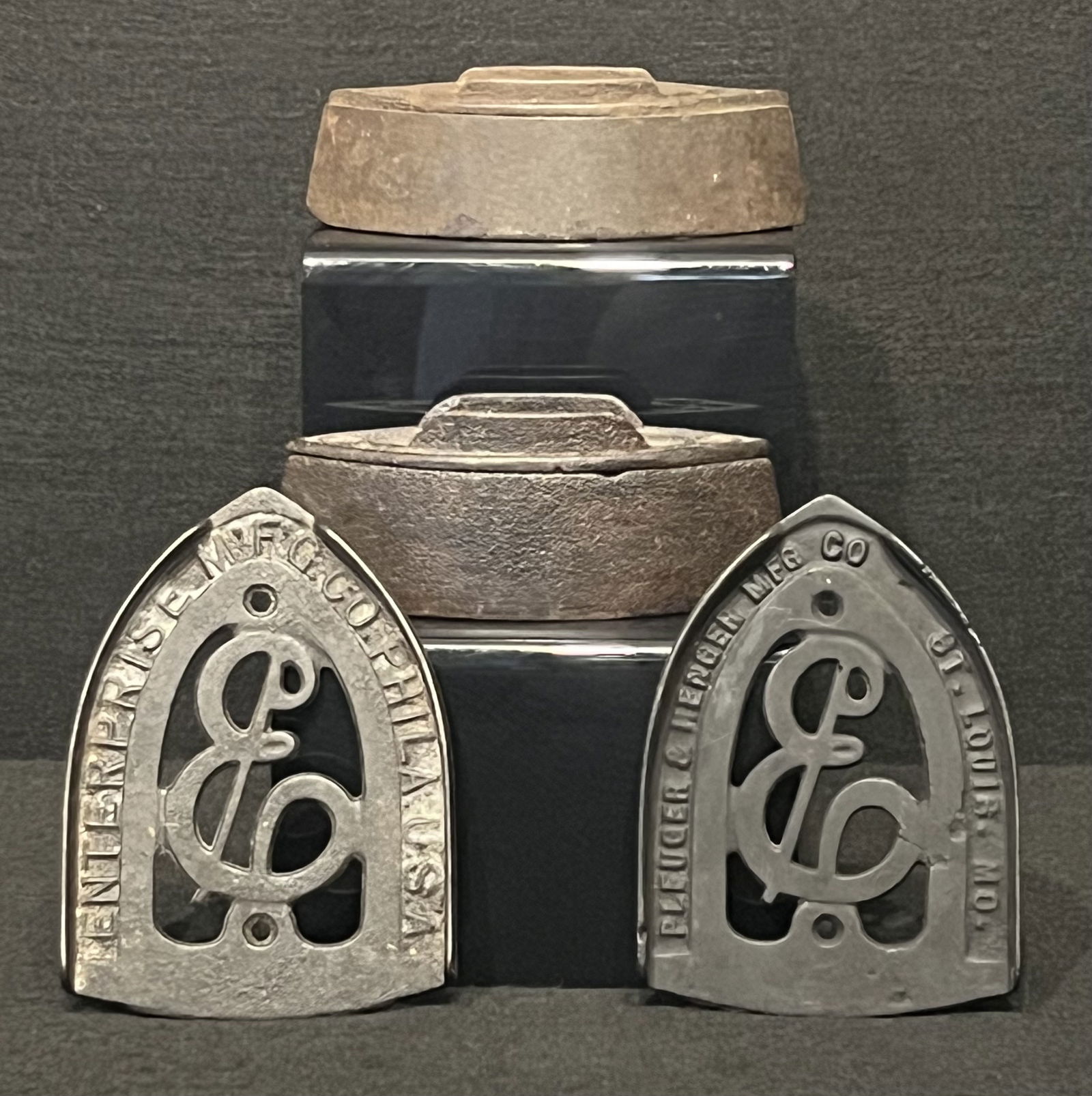 Antique Cast Iron Sad Irons and Trivets: These antique sad irons and trivets show wear that's representative their age. The sad iron trivets can also be used as kitchen trivets for your pots, pans and hot dishes. Howell Co. Geneva, IL 1867-1