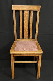 Vintage Oak Chair with Upholstered Seat: This lot offers an oak vintage side chair with padded seat. It seems to be in nice condition and padded seat is an attractive fabric secured with upholstry tacks. (38" x 18" x 15") (10lbs.) Estimate: