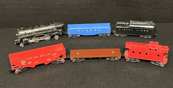 Vintage Colorful Lionel Train Engine, Cars and Caboose: Vintage 1970's Lionel Train engine and 1950's cars & caboose. The group of 6 cars, caboose & engine include metal and plastic construction: Black Lionel #246 O Scale Engine, Blue Lionel #6042 O Scale