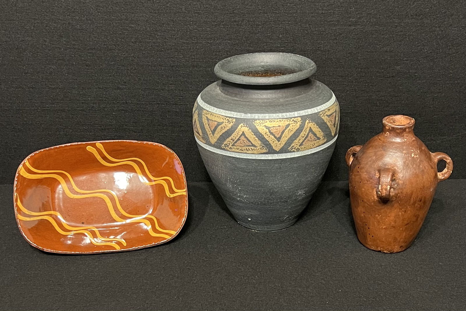 Antique Redware 3-Handle Jug, Vintage Clay Pottery Dish & Black Painted Clay Pottery Vase: A nice selection of special pieces that includes an antique Redware unglazed 3-handle jug which shows it's early production age. This primitive creation is a example of early redware. Redware is one-i