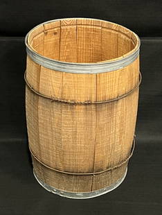 Antique Wooden Barrel with Metal Bands: The wooden barrel/keg used by a cooper to transport nails, gunpowder or liquids. The cooper is a craftsman who was skilled in constructing these wooden barrels. It's a fine example of woodworking & is