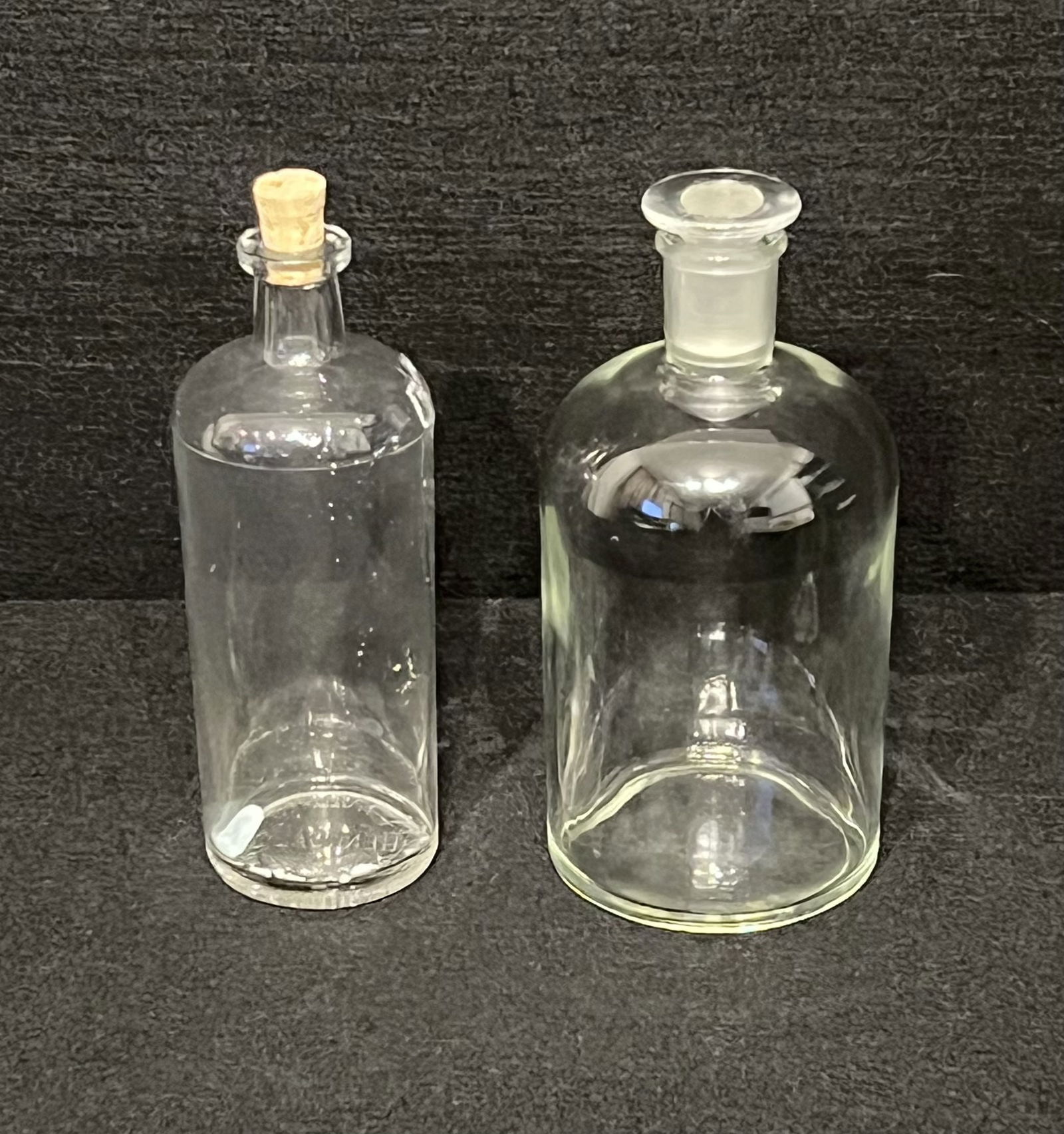 Vintage Apothecary Lavoris Chemical Glass Bottle with Cork & Large Pyrex 24 Bottle with Stopper: A great vintage apothecary Lavoris Chemical glass bottle with cork stopper was manufactured at the Chemical Co in Minneapolis. The glass is in fairly good condition but there's a few spots where somet
