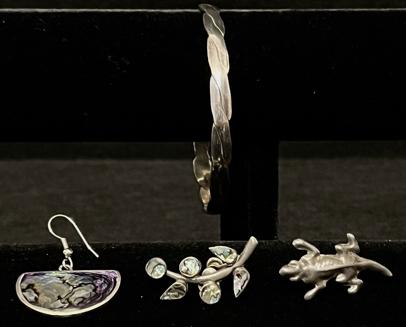 Mexican Silver 4-piece Misc.: 2.5" Silver braided bangle bracelet and three individual earrings: An abalone shell dangle earring, an abalone branch screw back style earring, and a silver lizard screw back style earring. These earr