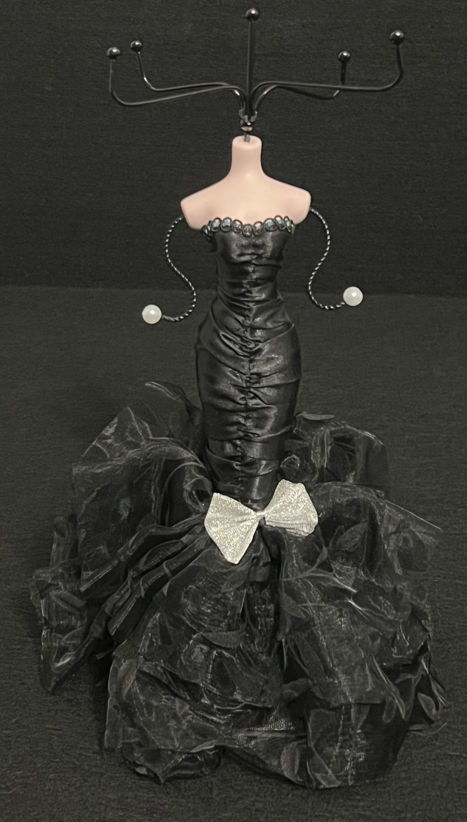 Doll Silhouette Jewelry Display: This mannequin style jewelry organizer holds multiple pieces of jewelry. She's dressed in a black satiny mermaid dress with faux pearls & rhinestones. It's attractive & shows only slight wear. (13" x 