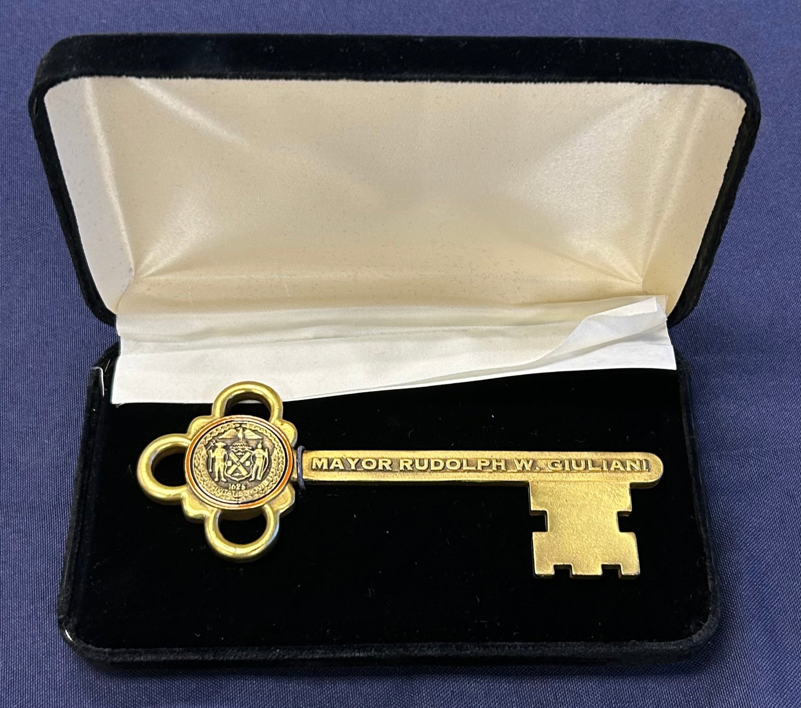 Fascimile of Key Made in 1812 for the Door of City Hall, New York given to Mickey by Mayor Giuliani: This Fascimile Key to City Hall was presented to Mickey Rooney by Mayor Rudy Giuliani. The key has a gold plated finish and is in its original black velvet box. The box has a gold-wash plaque on top e