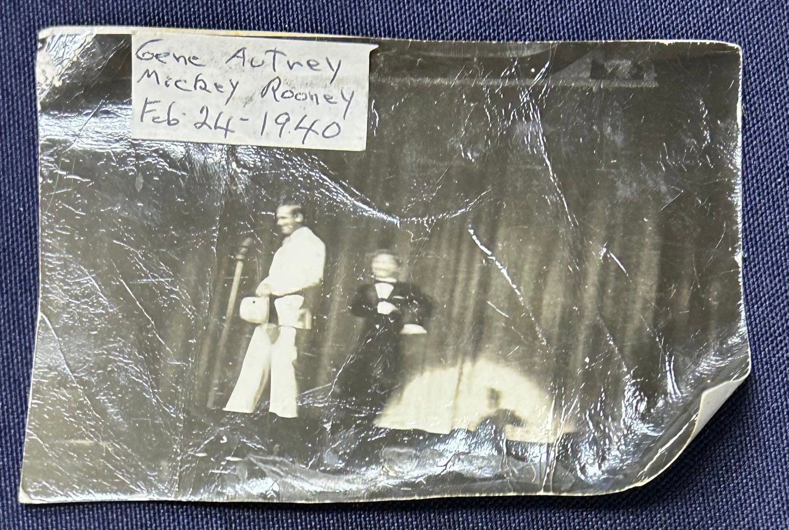 Old Black & White Photo of Mickey Rooney and Gene Autrey Stage Performance: Old black and white photo of Mickey Rooney and Gene Autrey performing on stage - dated February 24, 1940 measuring approximately 3 inches by 4 inches.