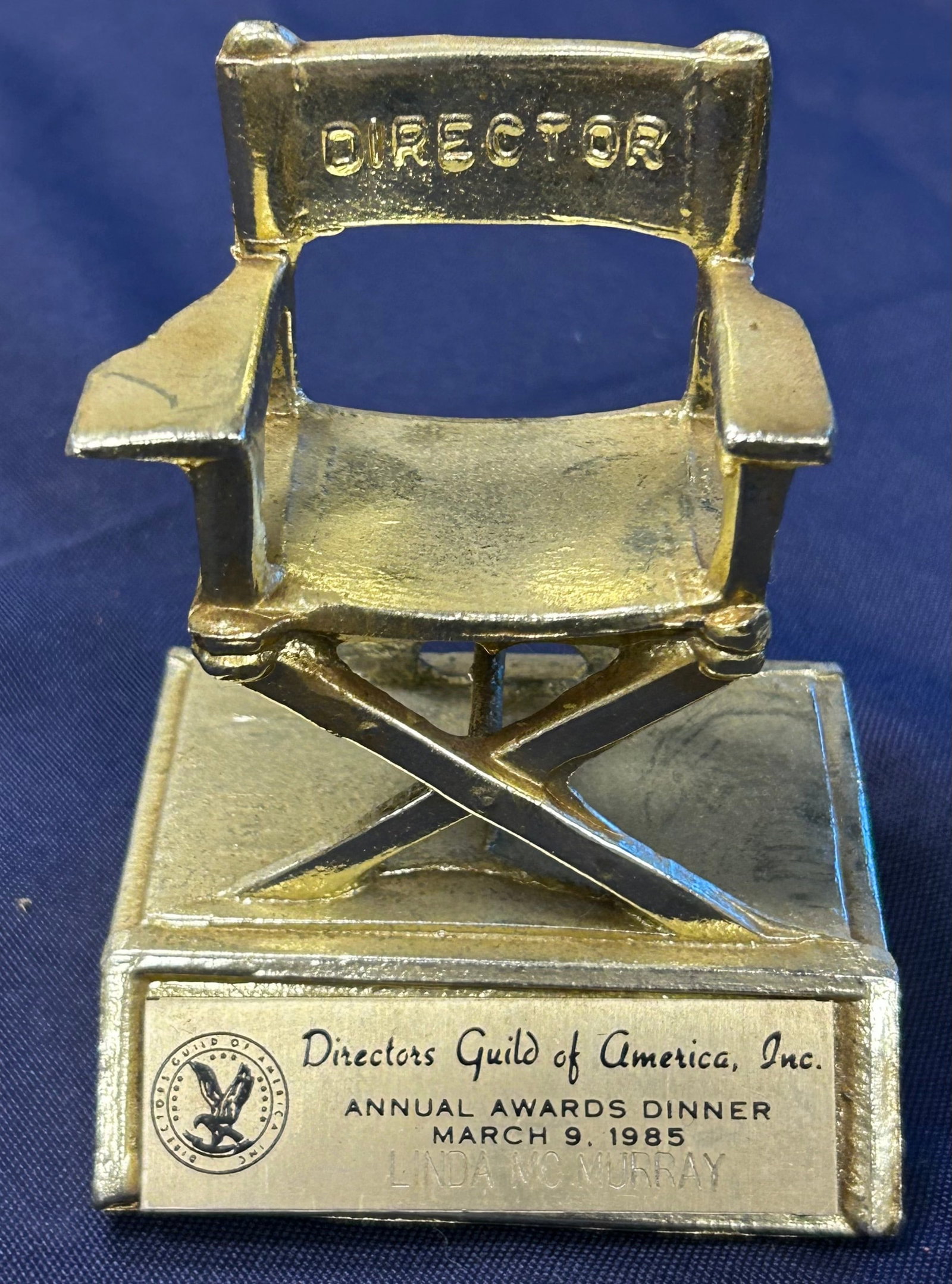 March 9, 1985 Directors Guild of America Annual Awards Dinner Miniature Director Chair: From the Estate of Mickey Rooney, a Directors Guild of America Annual Awards Dinner minitaure Director Chair with gold face plate for Director of Cheers, Linda McMurray, the second woman admitted to t