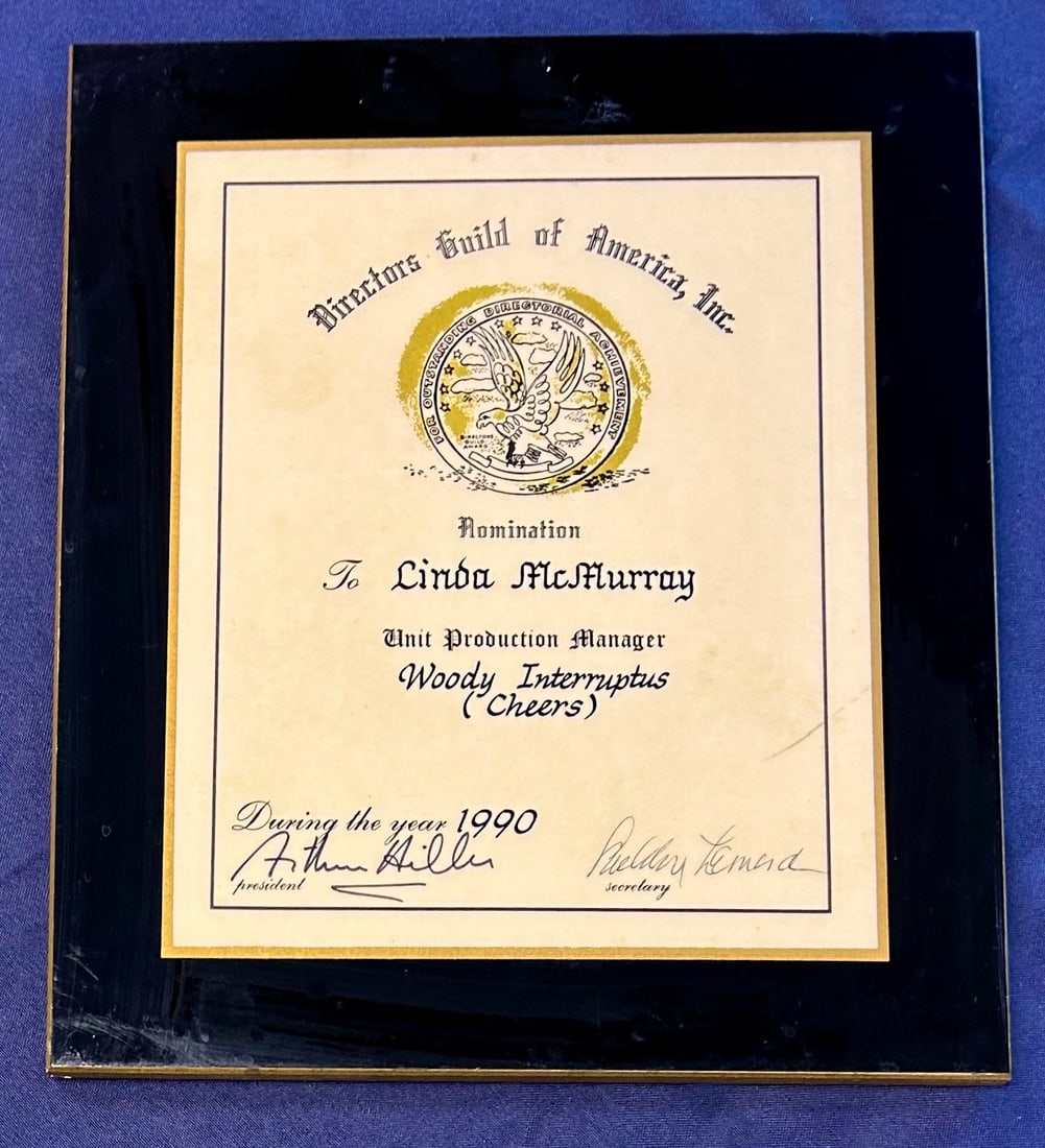 1990 Directors Guild of America Nomination Plaque Linda McMurray Woody Interuptus (Cheers): From the Estate of Mickey Rooney, a 1990 Directors Guild of America Nomination Plaque presented to Linda McMurray for the Cheers episode, Woody Interuptus with Woody Harrelson.