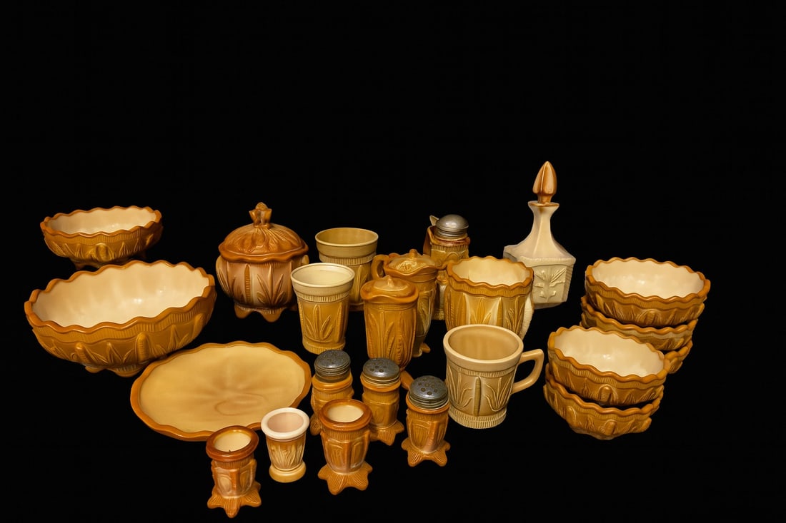 Vintage Marigold Slag Glass “Leaf & Bead" Pattern Tableware Collection – 26 Pieces: 26-piece marigold slag glass grouping including serving bowls, lidded pieces, mugs, shakers, footed cups, and small bowls. Warm caramel/cream swirls and scalloped rims. Largest bowl: 9½”