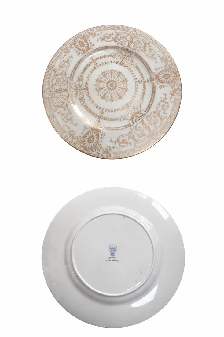 Set of Twelve (12) Royal Worcester Gold Decorated Dinner Plates: Cream ground with elaborate gilt neoclassical scrollwork and central medallion; scalloped gold border; marked to underside. Each approx. 10.5” dia. Overall good vintage condition with light wear