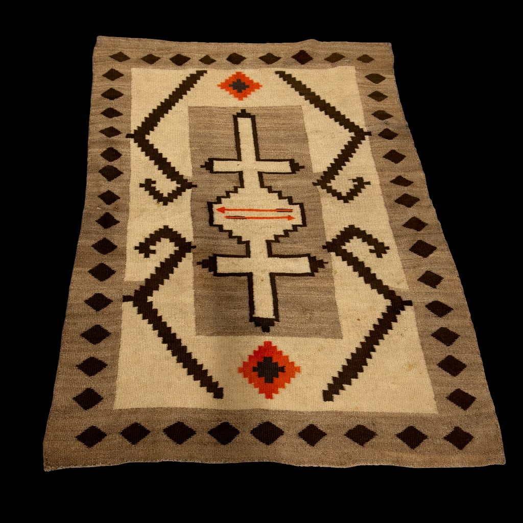 Handwoven Southwestern / Navajo-style wool rug with geometric motifs in tan, brown, and rust tones: Handwoven Southwestern / Navajo-style wool rug with geometric motifs in tan, brown, and rust tones, approx. 5’7” L x 3’9” W, traditional stepped and diamond pattern, likely mid-20th ce