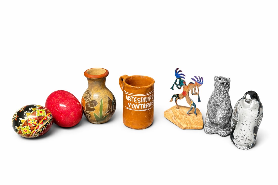 Mixed Decorative Folk Art & Studio Objects Group (7 pcs: Includes two hand-decorated eggs (one geometric painted, one polished red stone), small Mexican folk art pottery vase, Artesanías Monterrey terracotta mug, hand-cut metal deer dancer figure on wood