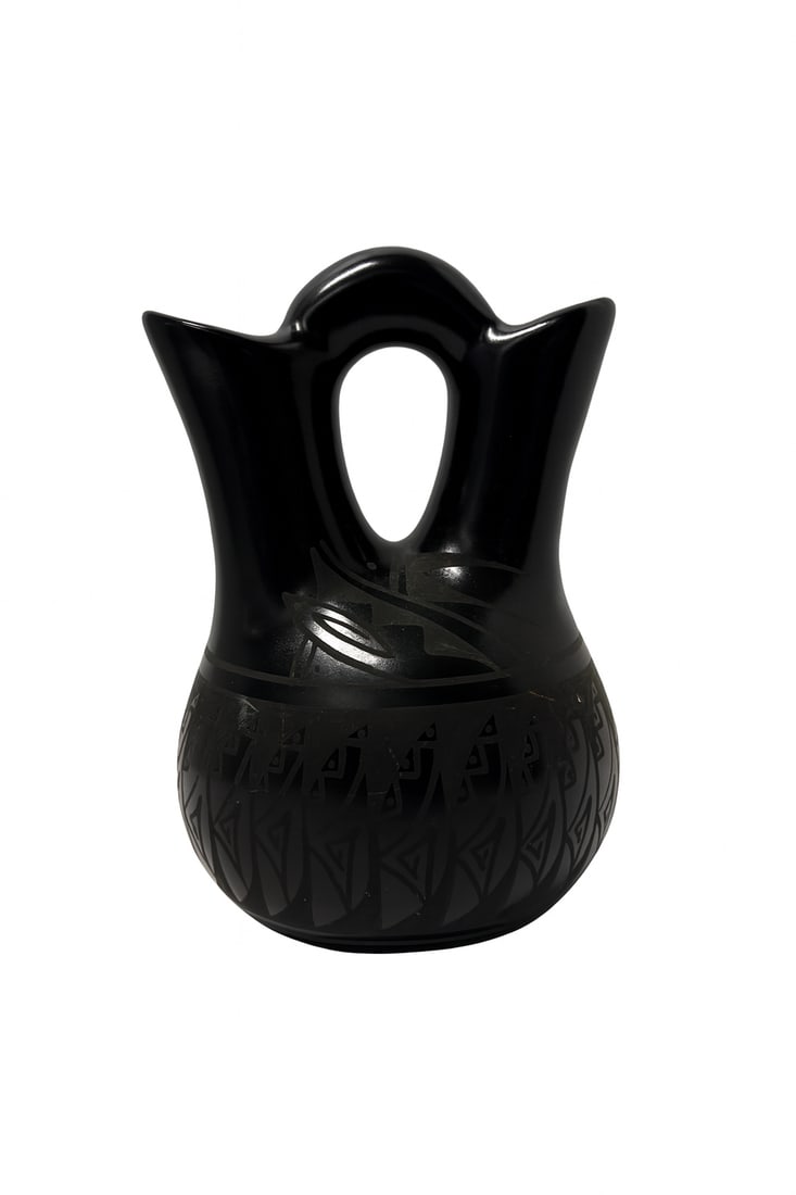 Native American Blackware Wedding Vase by Veronica Yabeny (Navajo), 8 in. H: Native American Blackware Wedding Vase by Veronica Yabeny (Navajo). Hand-carved and stone-polished with incised geometric and feather motifs; traditional double-spout wedding form. Includes original