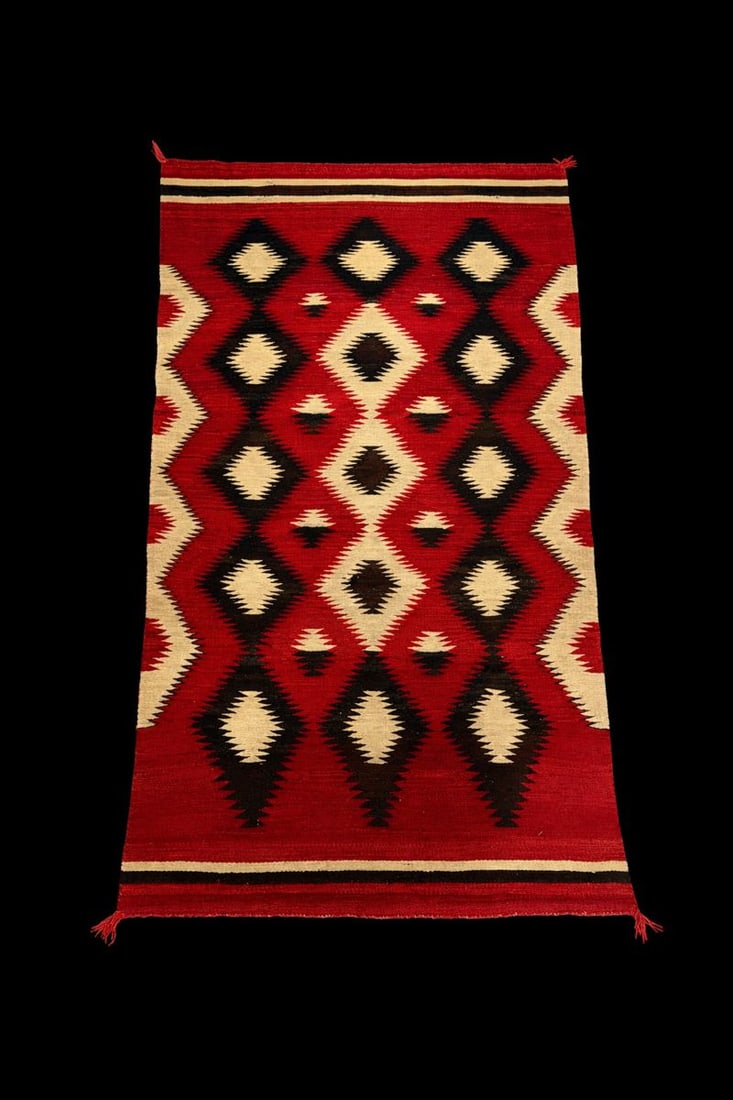 Southwestern Geometric Woven Rug, Wool, Red/Black/Cream: Handwoven Southwestern-style rug featuring bold stepped diamond motifs in deep red, black, and natural cream tones; wool construction with flatwoven texture and short fringe ends; suitable for floor