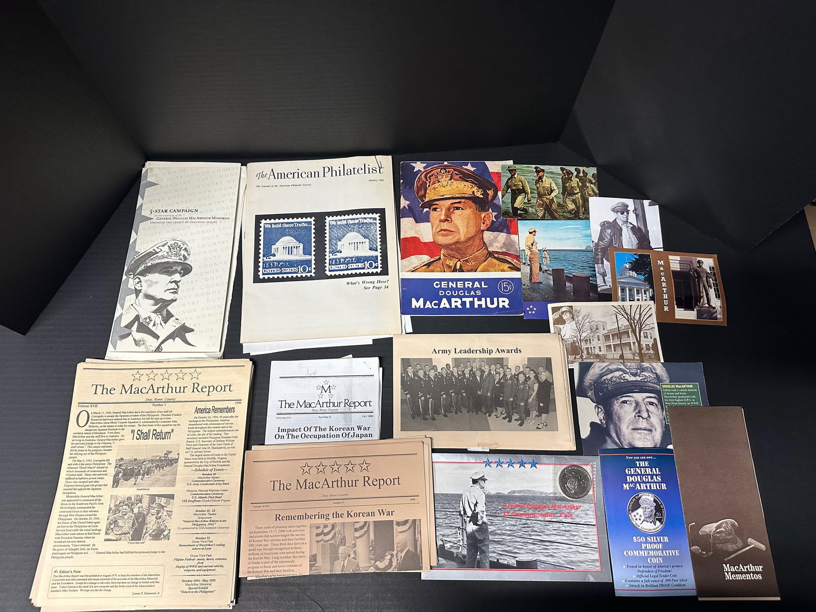 General Douglas MacArthur Historical Ephemera Collection: Approx. 20-piece paper & postcard lot. including multiple issues of The MacArthur Report, American Philatelist “MacArthur” feature with stamps, Army leadership award booklet,memorial and museu