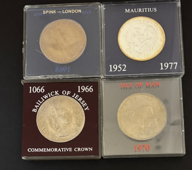 4 British Commonwealth Crown Coins 1952–1988: Group of four British Commonwealth commemorative crown coins including 1988 Gibraltar Crown (Spink London case), 1952–1977 Mauritius Crown, 1966 Bailiwick of Jersey 1066–1966 Commemorative Crown