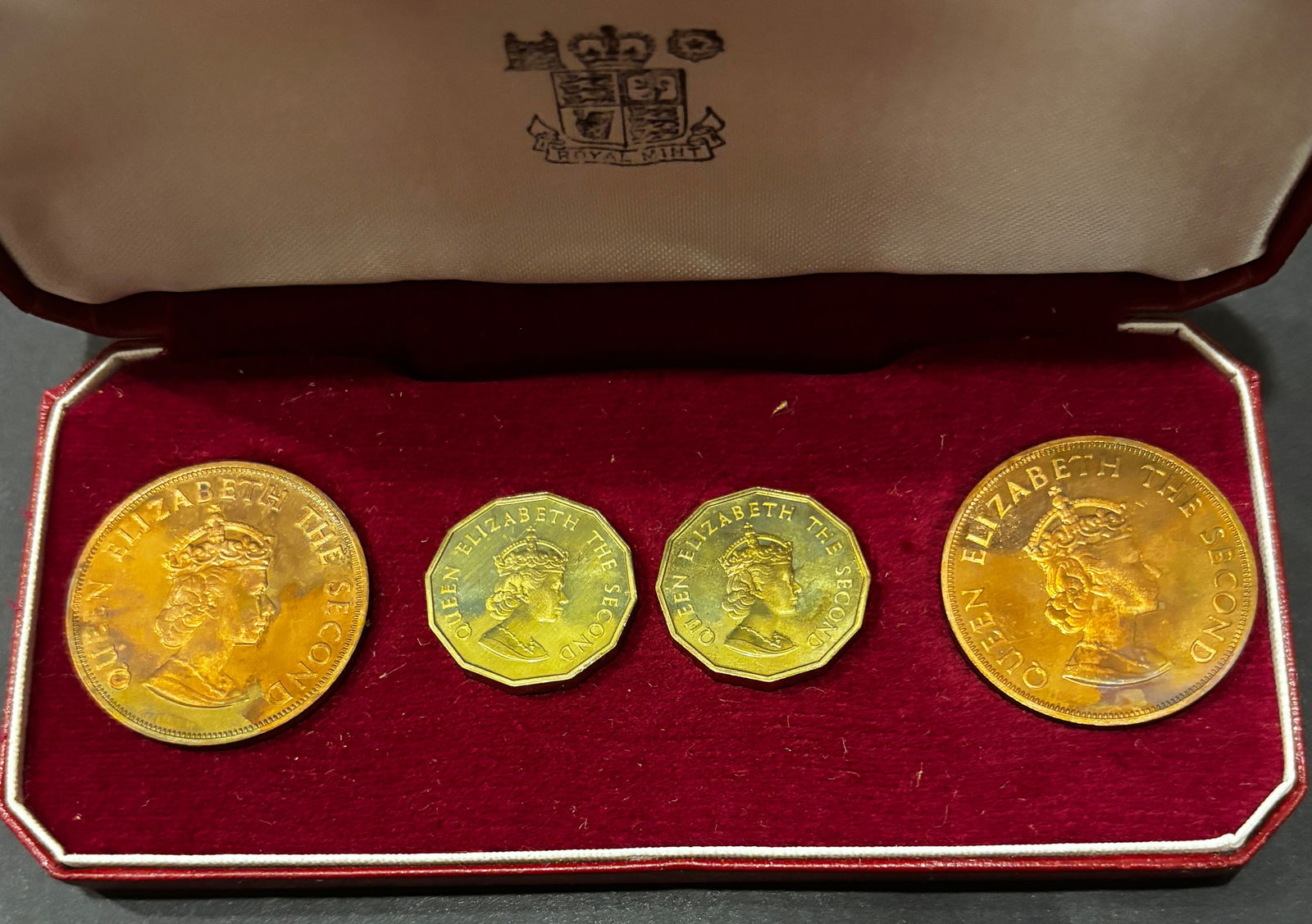 1964 Jersey Gold Proof 4-Coin Set Royal Mint Case: 1964 Bailiwick of Jersey four-coin gold proof set issued by the Royal Mint. Struck in .9167 fine (22K) gold with an approximate total gross weight of 7.4–7.5 grams and estimated actual gold weight o
