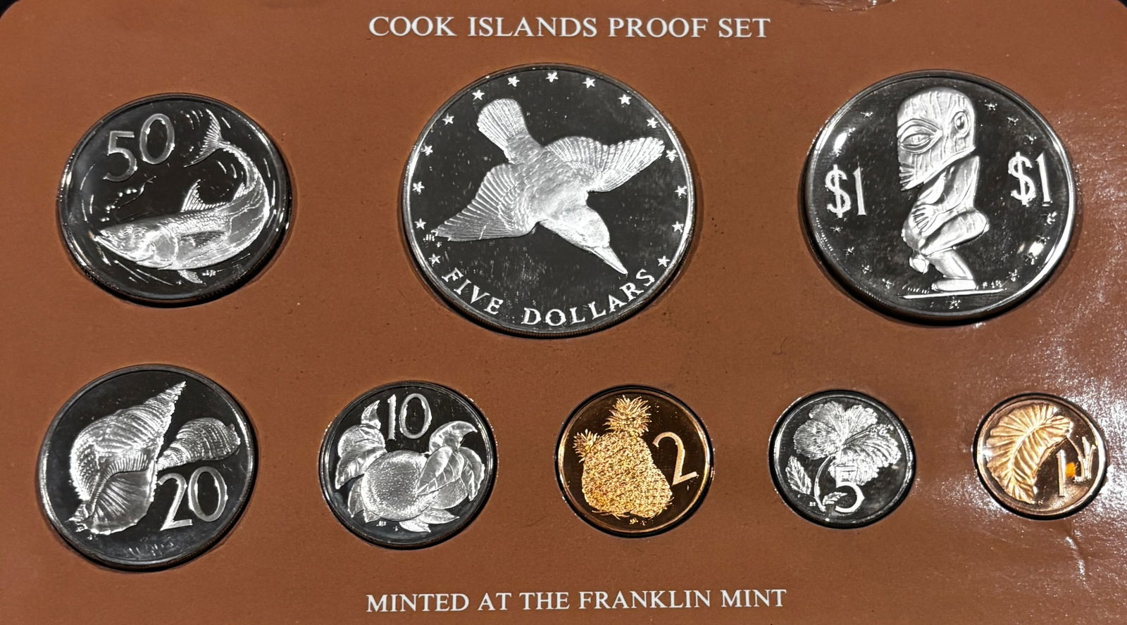 1976 Cook Islands Proof Coin Set w/ .500 Silver $5 Crown Franklin Mint Case & COA: Official 1976 Cook Islands proof coinage set issued under authorization of the Cook Islands government and struck by the Franklin Mint. Mirror-finish proof coins featuring Queen Elizabeth II