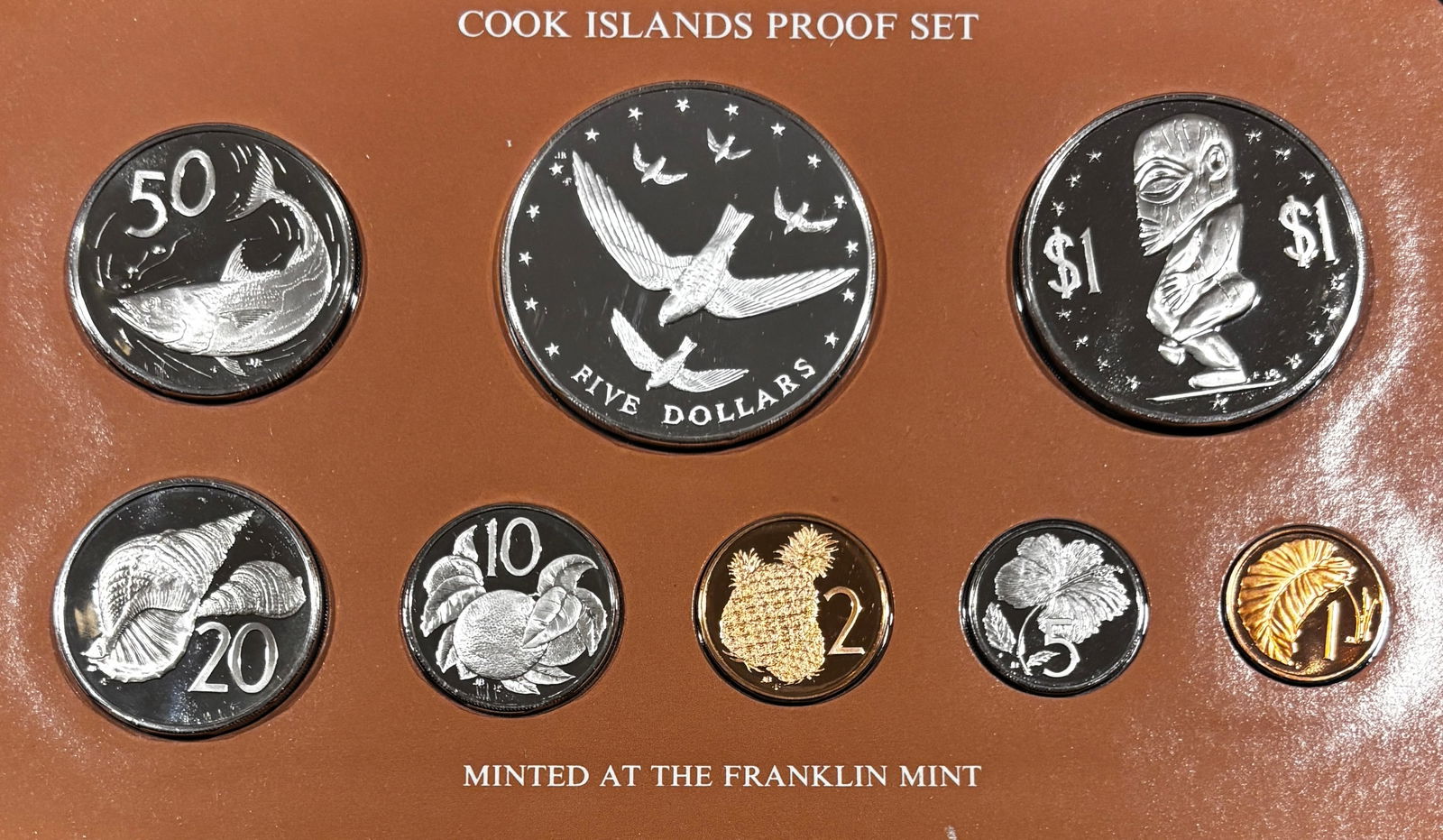 1977 Cook Islands Proof Coin Set w/ .500 Silver $5 Crown Franklin Mint & COA: Official 1977 Cook Islands proof coinage set struck by the Franklin Mint under government authorization. Mirror-finish proof coins featuring Queen Elizabeth II portraits and island wildlife designs;