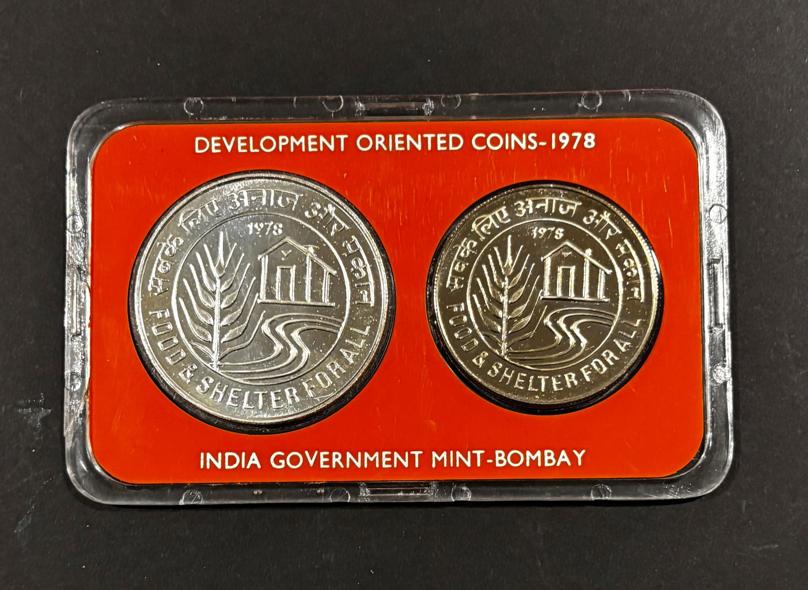 1978 India Development Oriented Coins Proof Set Bombay Mint Food & Shelter For All: 1978 India “Development Oriented Coins” Proof Set issued by the India Government Mint, Bombay, comprising 50 Rupees and 10 Rupees commemoratives featuring the Ashoka Lion Capital obverse and