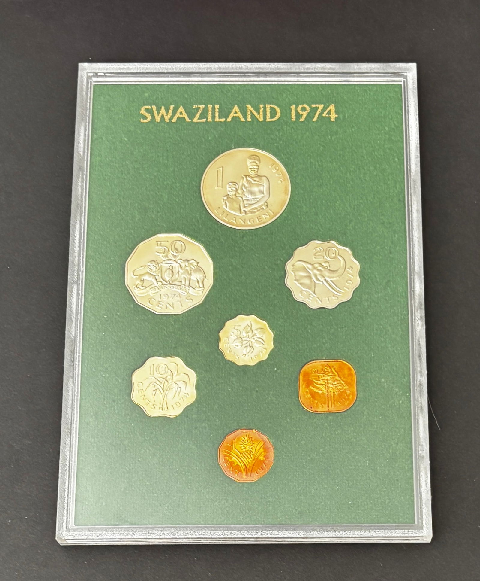 1974 Swaziland Proof Coin Set In Original Holder: Original 1974 Kingdom of Swaziland proof coin set housed in the original presentation holder. The set includes the full denomination series from 1 Lilangeni through 1 Cent featuring national wildlife