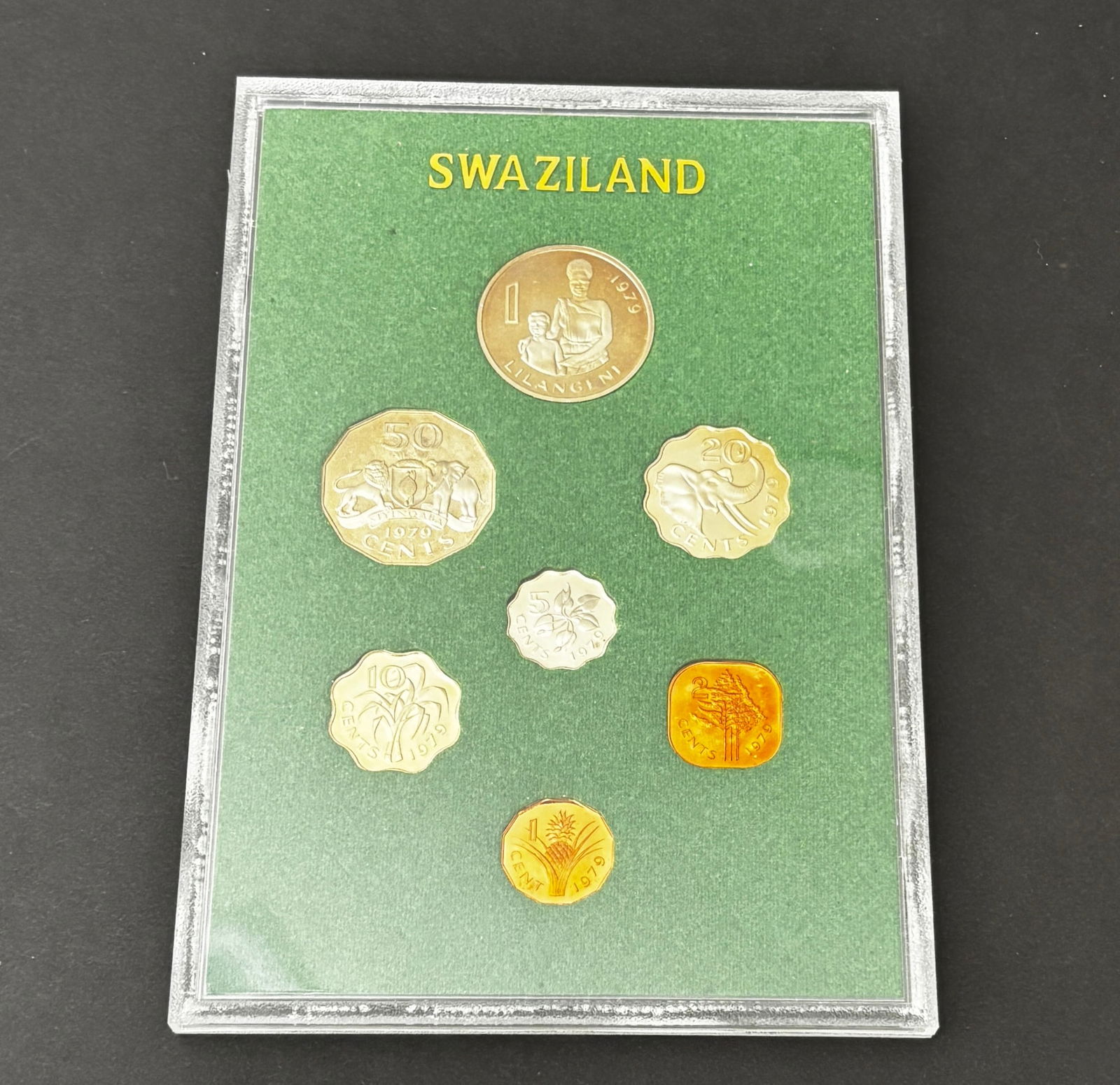 1979 Swaziland Proof Coin Set In Original Holder: Original 1979 Kingdom of Swaziland proof coin set housed in the original presentation holder. The set includes the full denomination series from 1 Lilangeni through 1 Cent featuring portrait and wildl