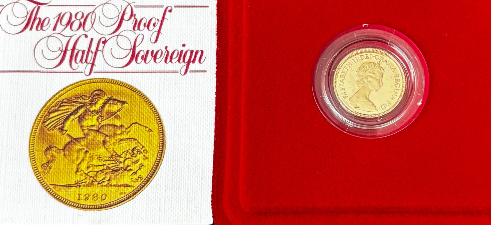 1980 Great Britain Proof Half Sovereign Gold Coin In Original Box: 1980 Great Britain proof Half Sovereign gold coin issued by the Royal Mint and presented in the original red velvet case with certificate. The coin features the Elizabeth II portrait obverse and the c