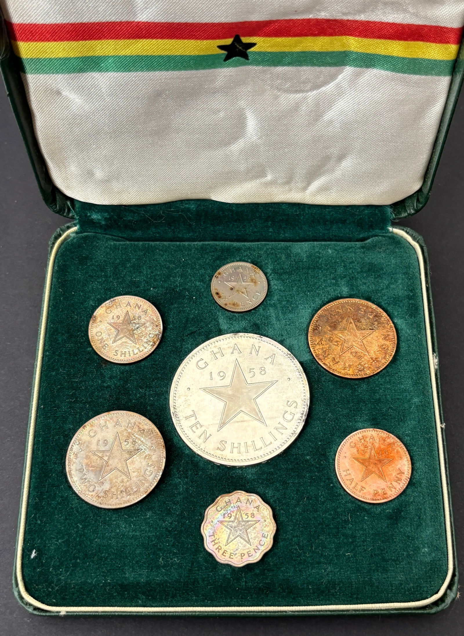 1958 Ghana Proof Coin Set In Original Case Kwame Nkrumah: Complete 1958 Republic of Ghana proof coin set issued at independence featuring portrait of Kwame Nkrumah and star motifs, housed in the original fitted presentation case with Ghana flag interior. Set