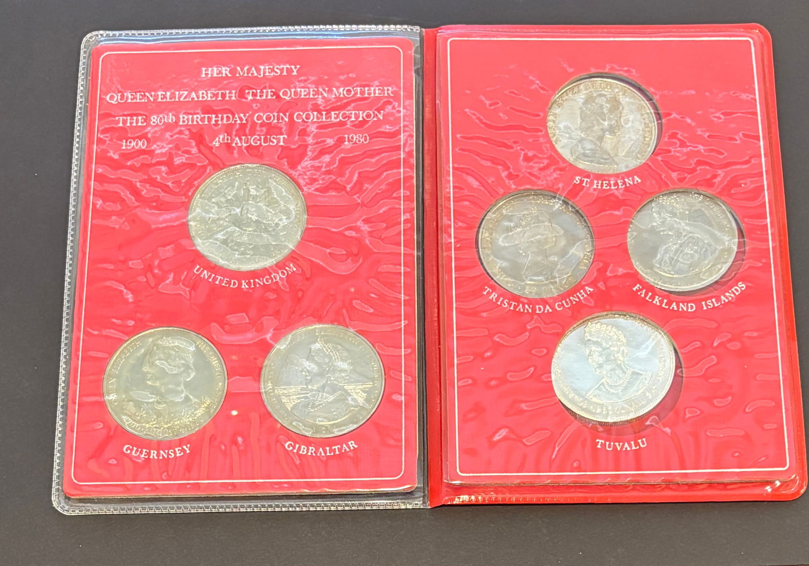 1980 Queen Elizabeth The Queen Mother 80th Birthday Coin Collection Set: Her Majesty Queen Elizabeth The Queen Mother 80th Birthday commemorative coin collection dated August 4, 1980, featuring multiple legal-tender issues from Commonwealth territories including United Kin