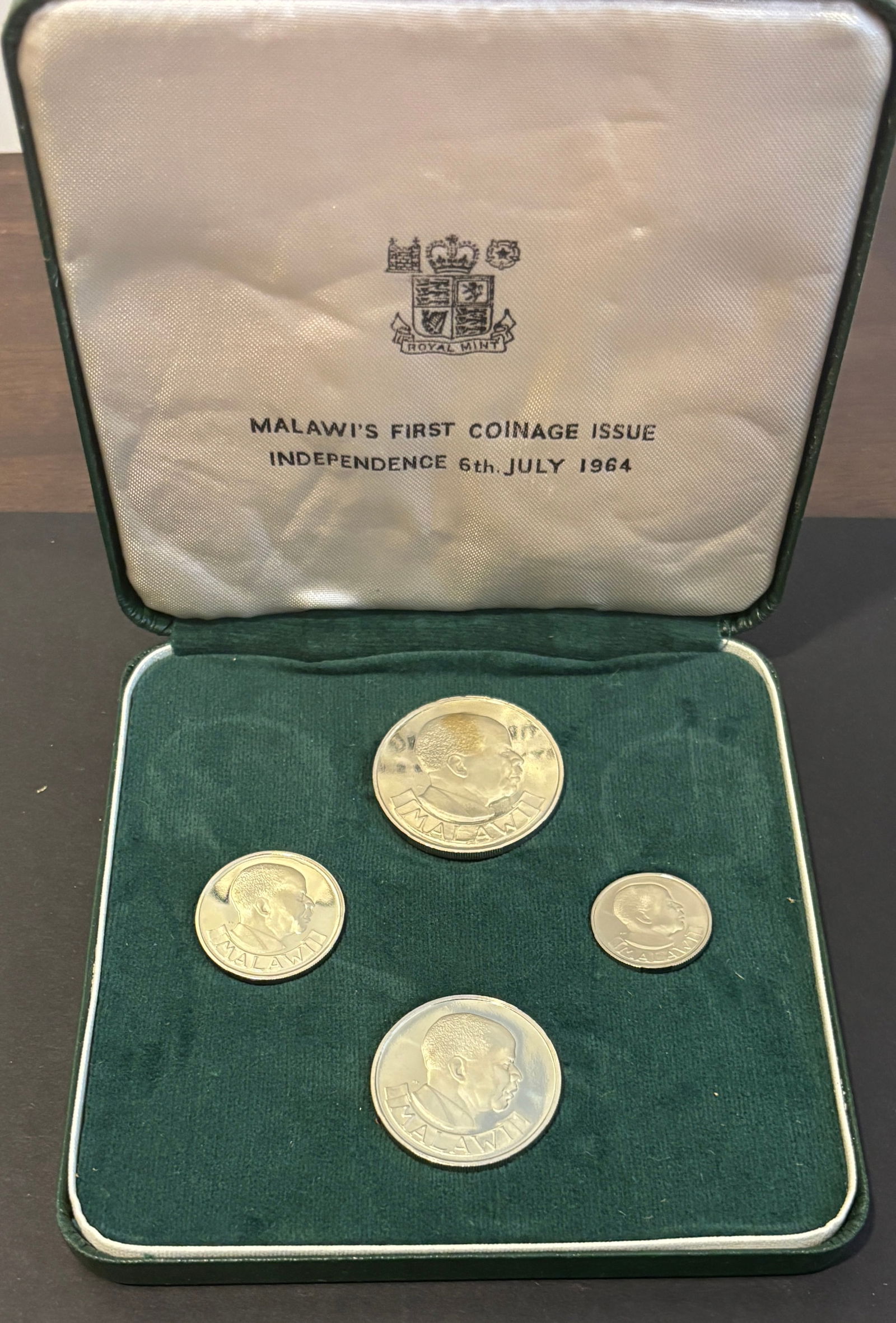 1964 Malawi Independence First Coinage Silver Proof 4-Coin Set In Royal Mint Case: 1964 Malawi “First Coinage Issue” Independence proof set commemorating July 6, 1964, consisting of four silver coins: Crown, Florin, One Shilling and Six Pence. Obverses depict Dr. Hastings Ka