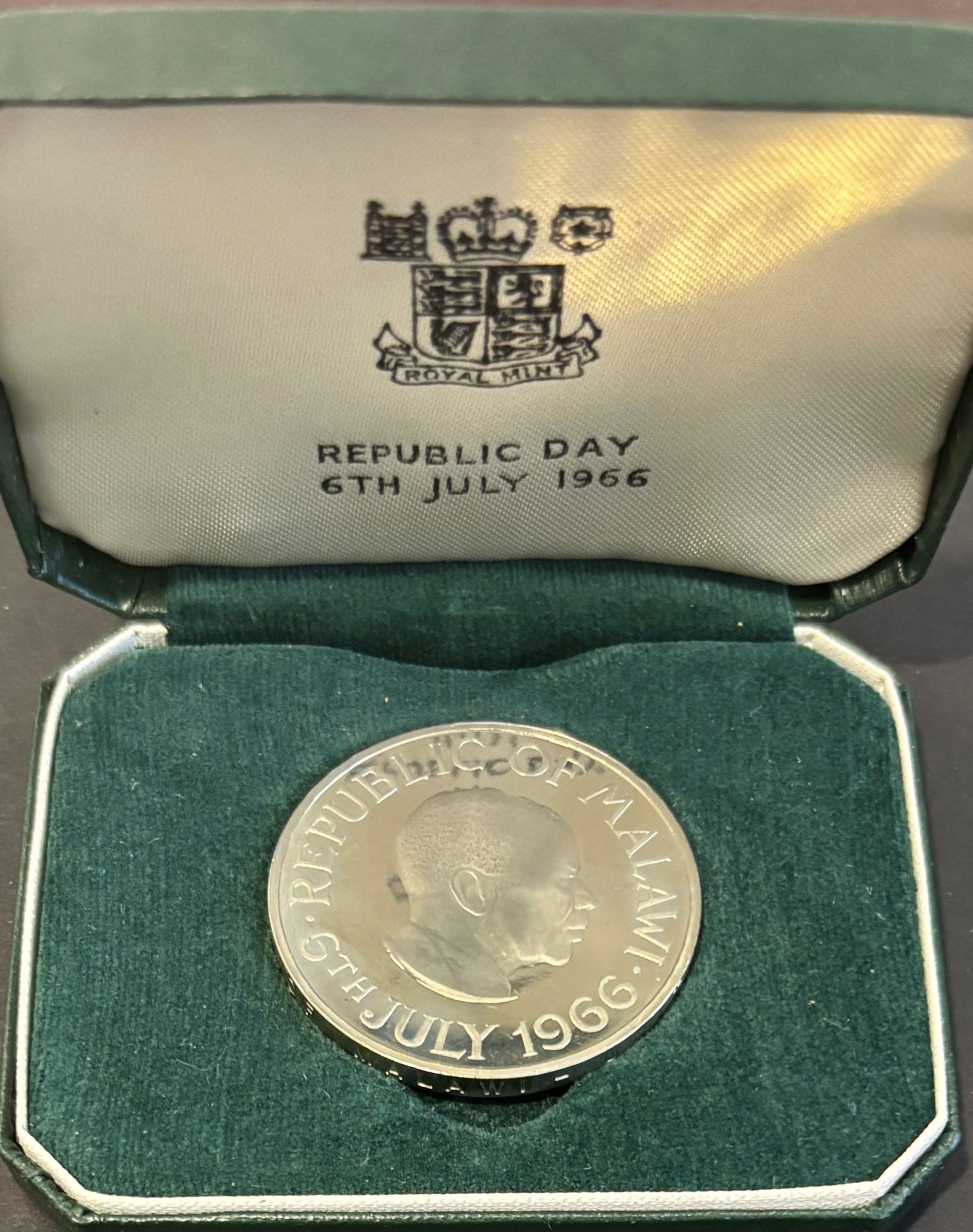 1966 Malawi Republic Day One Crown Silver Proof Coin In Royal Mint Case: 1966 Malawi Republic Day commemorative One Crown proof coin marking July 6, 1966, struck by the Royal Mint. Obverse features Dr. Hastings Kamuzu Banda with surrounding Republic of Malawi legend and da