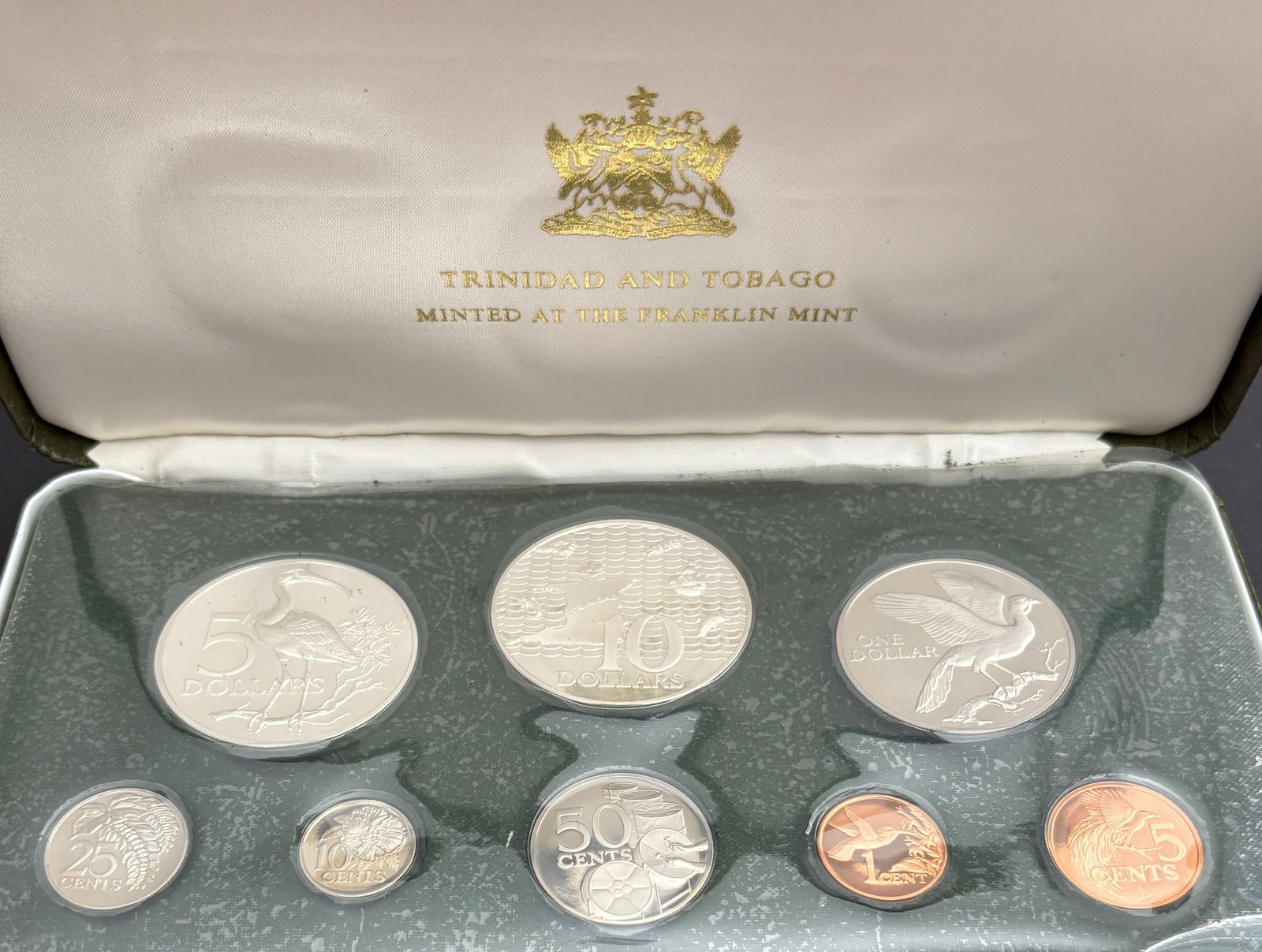 1974 Trinidad and Tobago Eight-Coin Proof Set – Franklin Mint With COA & Case: 1974 Trinidad and Tobago eight-coin proof set issued under authorization of the government and struck by the Franklin Mint, housed in the original presentation case with certificate of authenticity da