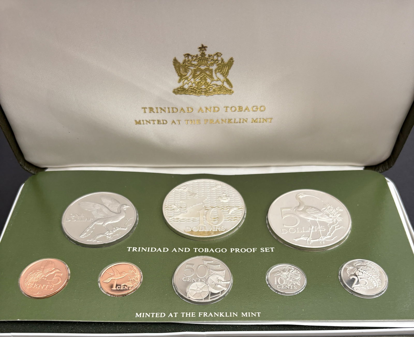 1975 Trinidad And Tobago Eight-Coin Proof Set Franklin Mint With COA: 1975 Trinidad and Tobago eight-coin proof set issued by the government of Trinidad and Tobago and struck by the Franklin Mint, housed in original presentation case with certificate of authenticity dat