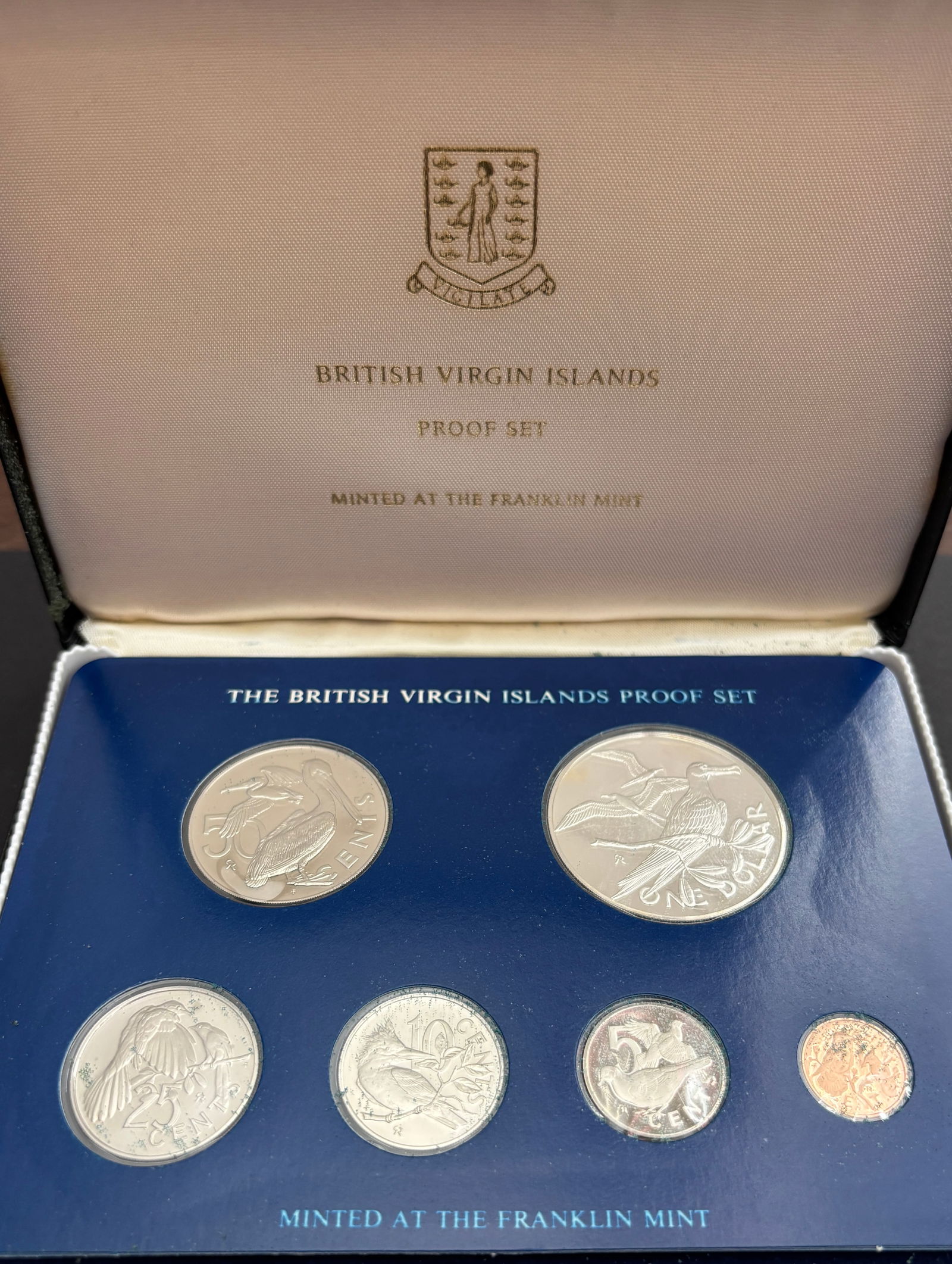 1976 British Virgin Islands Franklin Mint Proof Coin Set With COA: Original 1976 British Virgin Islands proof coinage set struck by the Franklin Mint and housed in the original blue presentation case with certificate of authenticity. Eight-coin set includes $1, 50¢,