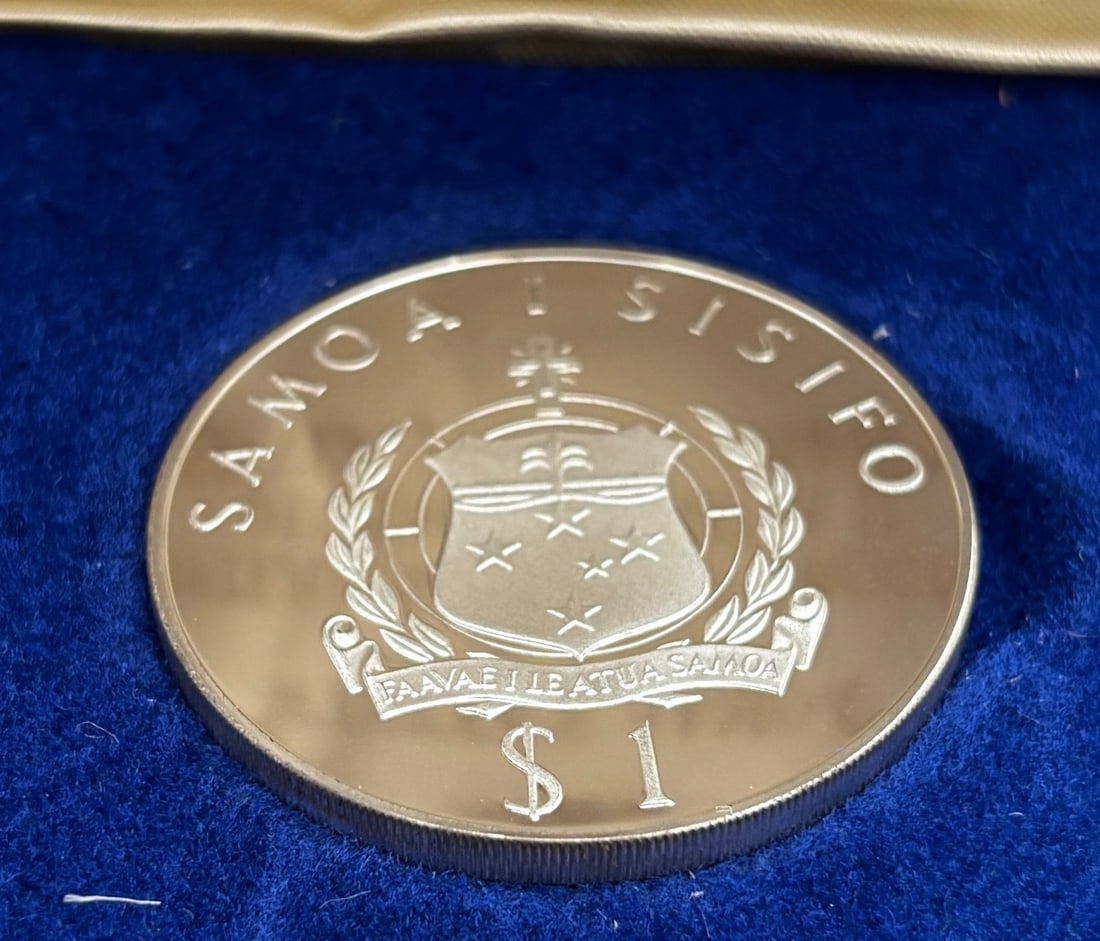 1977 Western Samoa Tala Sterling Silver Proof Coin – Queen Elizabeth II Silver Jubilee: 1977 Western Samoa Tala sterling silver proof coin issued in commemoration of the Silver Jubilee of Queen Elizabeth II (1952–1977), struck in solid .925 sterling silver by The Franklin Mint. Obverse